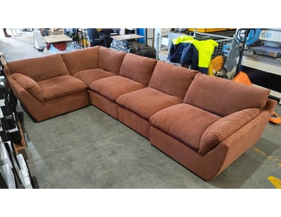 Modular sectional sofa in terracotta/rust upholste...