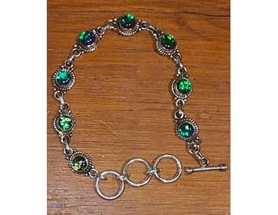 62 TCW STERLING SILVER AND OPAL TRIPLET BRACELET. ...