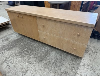 Light oak timber sideboard featuring a clean, cont...