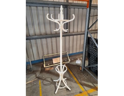 Elegant white bentwood coat stand featuring a trad...