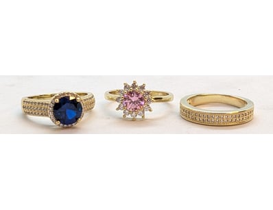 THREE FAUX GOLD COLOURED STONE RINGS

Condition: G...