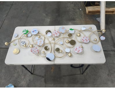 Decorative wall-mounted kinetic sculpture featurin...