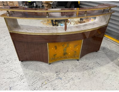 Elegant curved display counter featuring premium m...