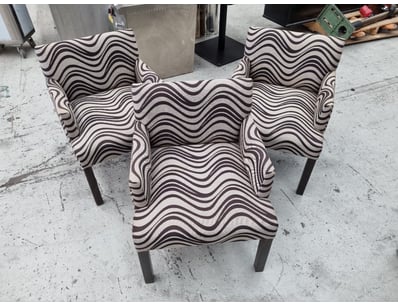 Set of three contemporary dining chairs featuring ...
