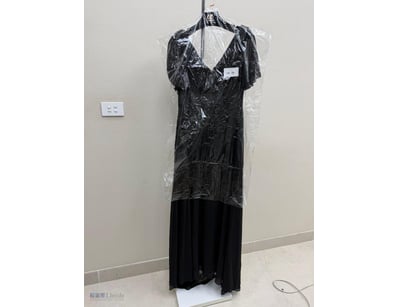BLACK PLEATED EVENING GOWN WITH FLUTTER SLEEVES

I...