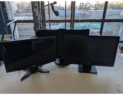 Lot of three computer monitors, various models.
...