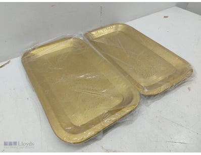 Pair of gold-coloured decorative Metal serving tra...