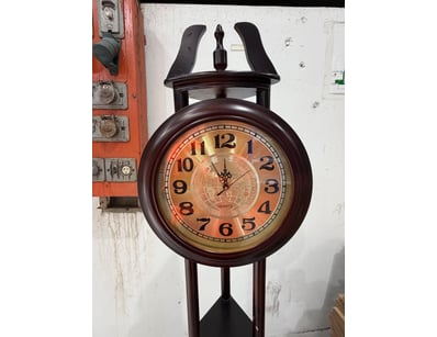 Vintage floor standing pendulum clock featuring a ...