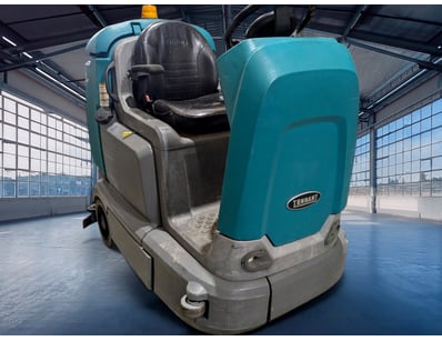 Tennant T12 XP ride-on floor scrubber in turquoise...