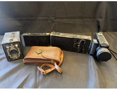 CAMERA COLLECTION WITH LEATHER ACCESSORIES

Item...