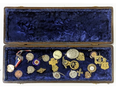 ANTIQUE MEDAL AND BADGE COLLECTION IN FITTED WOODE...