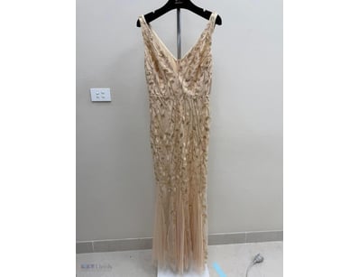 CHAMPAGNE BEADED EVENING GOWN WITH PLEATED SKIRT

...