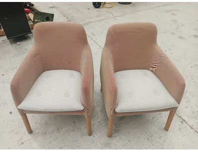 Pair of contemporary upholstered armchairs featuri...