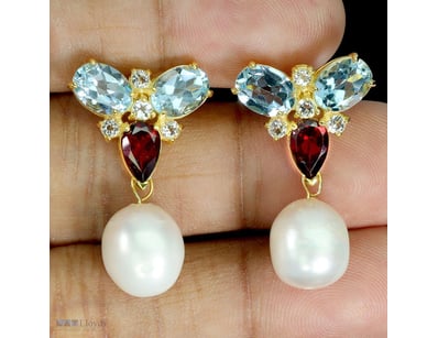 NATURAL PEARL TOPAZ & GARNET EARRINGS     

Natura...