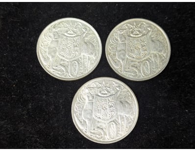 THREE SILVER 1966 ROUND FIFTY CENT COINS

Condit...