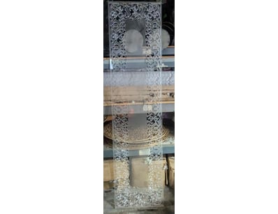 Decorative acrylic display tower featuring ornate ...