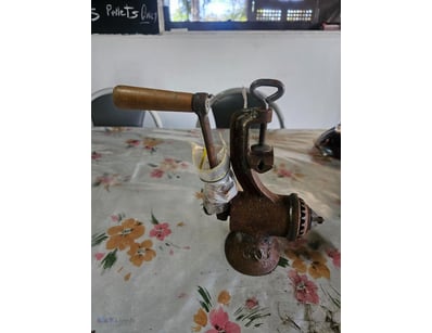 Vintage cast iron hand-crank meat mincer grinder

...