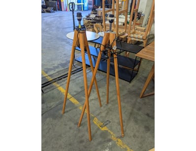 Wooden tripod floor lamp featuring three splayed w...