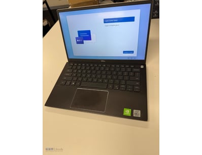 Dell laptop computer in silver finish featuring a ...