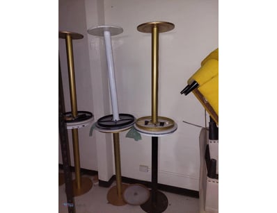 Modern bistro-style pedestal table featuring a bra...