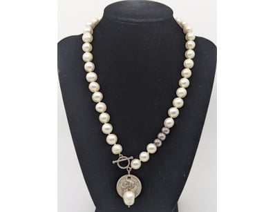 PEARL AND SILVER COIN PENDANT NECKLACE

An Elega...