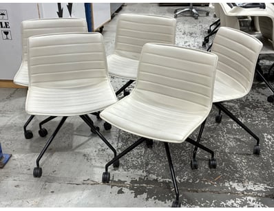 Set of five modern office chairs featuring white p...