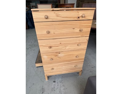 Pine chest of drawers featuring six spacious drawe...