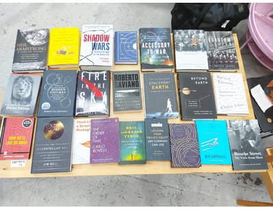Collection of books spanning non-fiction, biograph...