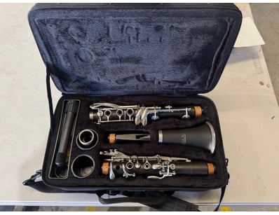 Professional clarinet outfit comprising two wooden...