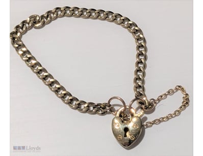 9CT GOLD SILVER FILLED PADLOCK BRACELET     

Mark...