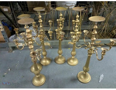 Impressive collection of brass candelabra in class...