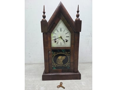 Victorian-era steeple or gable clock featuring a d...
