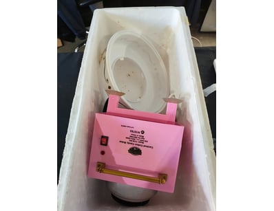 Vintage pink carnival-style cotton candy maker wit...