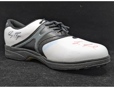 SIGNED GOLF SHOE WITH FIVE PLAYER SIGNATURES

Co...