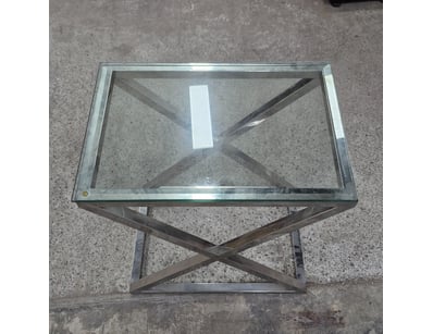 Modern glass and stainless steel side table featur...