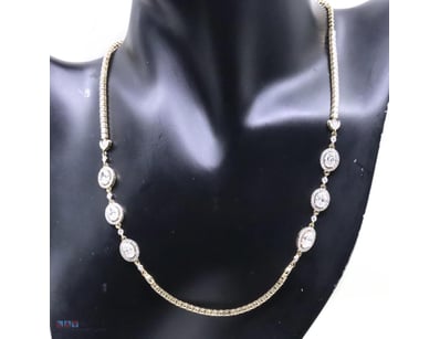 14K YELLOW GOLD AND DIAMOND, HALO NECKLACE.      
...