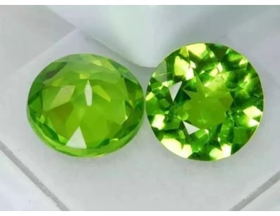0.56 CARAT GREEN ROUND PERIDOT PAIR        

Condi...