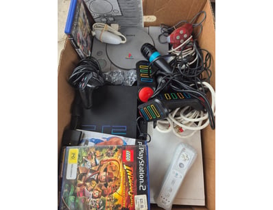 Retro gaming console bundle featuring a Sony PlayS...