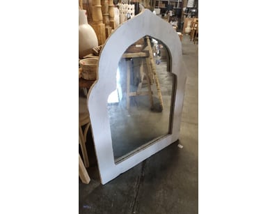 White-painted arched mirror frame with contemporar...
