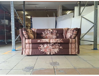 Upholstered 2 seater sofa featuring a floral desig...