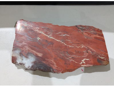 Striking polished red agate specimen featuring dra...