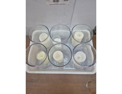 Lot of 6 ledlight candles with candle holders.

So...