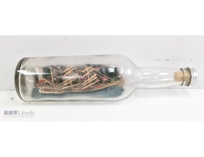 WOODEN SAILING SHIP MODEL IN GLASS BOTTLE

Item Si...