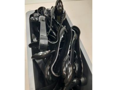 Tongs, black plastic finish.

Unknown quantity....