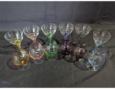 SET OF SIX COLOURED STEM GLASSES WITH TWISTED STEM...