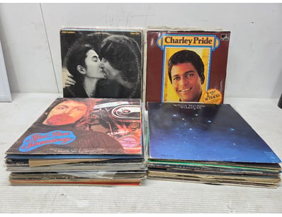 Vinyl records collection spanning multiple genres ...
