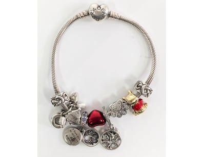 Pandora sterling silver bracelet. Featuring a hear...