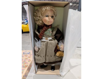 Homeart Collector's Doll featuring a porcelain bis...