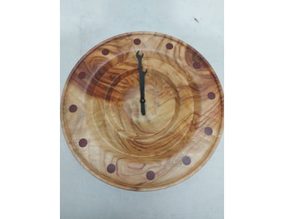 Handcrafted wooden wall clock featuring a circular...