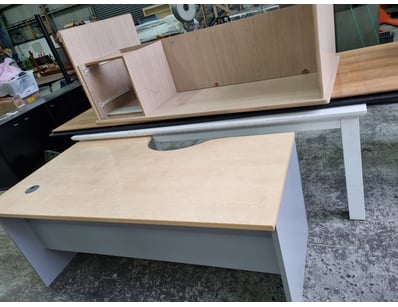 Assortment of tables, table tops, desks, wood type...
